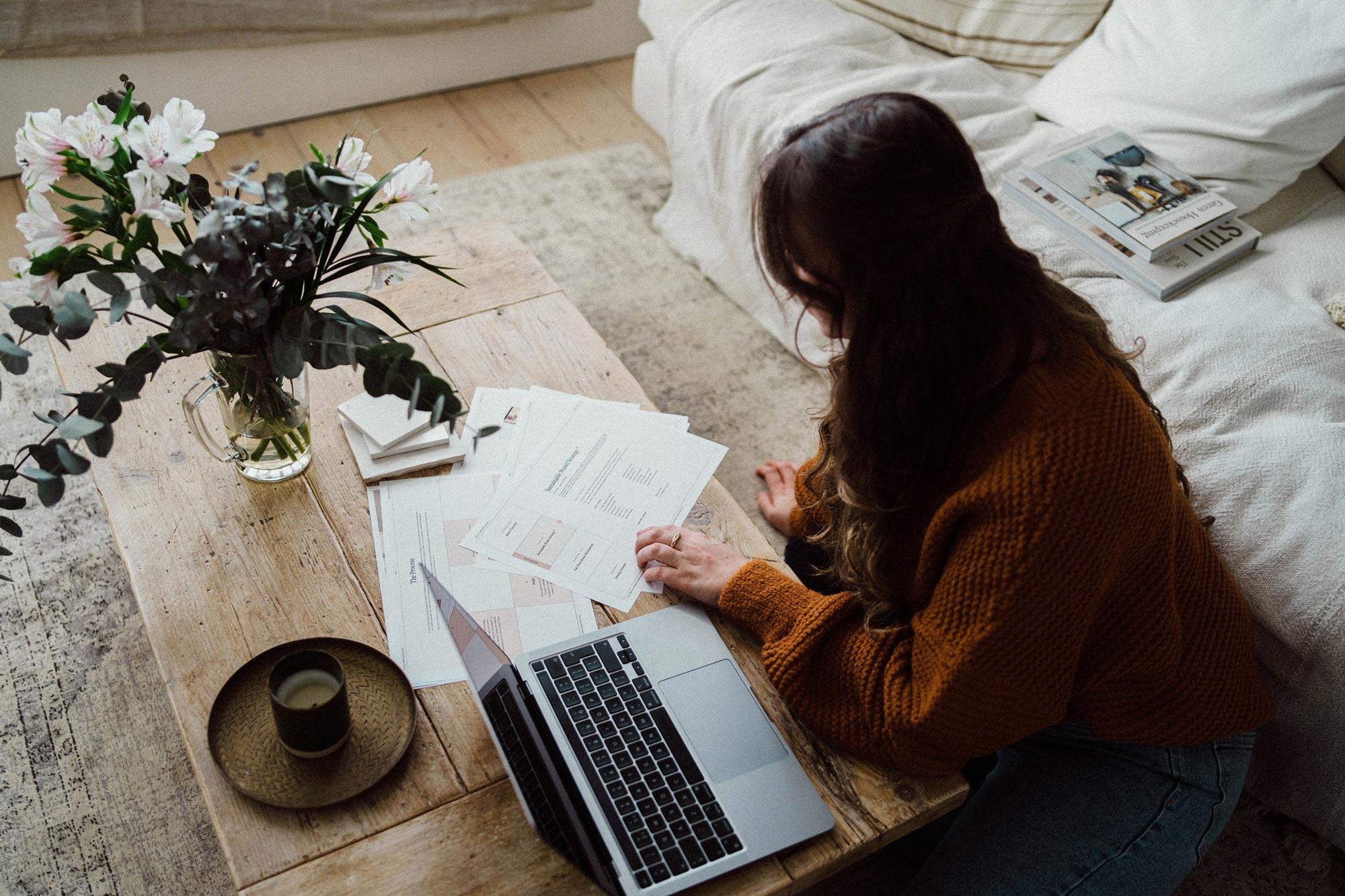 Female brand marketing coach sat at laptop